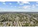 Aerial view of neighborhood with cloudy blue sky above at 5611 Burlington N Ave, St Petersburg, FL 33710