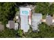 Overhead angle revealing an inviting pool area, enclosed patio, and well maintained roofing system at 5611 Burlington N Ave, St Petersburg, FL 33710