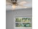 Bright bedroom with fan, light colored walls and window. Enjoy serene relaxation at 5611 Burlington N Ave, St Petersburg, FL 33710