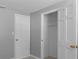 Bedroom featuring neutral grey walls, white trim, and a closet with an open door at 5611 Burlington N Ave, St Petersburg, FL 33710