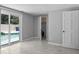 Bedroom with tile flooring leading to a pool area visible through sliding glass doors at 5611 Burlington N Ave, St Petersburg, FL 33710