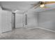 Light bedroom with neutral color scheme, ceiling fan, and a spacious closet, perfect for comfort at 5611 Burlington N Ave, St Petersburg, FL 33710