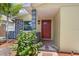 Close-up of the front door and porch showing the stone columns and brick walkway at 5611 Burlington N Ave, St Petersburg, FL 33710