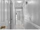 Hallway with marble flooring and a sun tunnel bringing natural light indoors at 5611 Burlington N Ave, St Petersburg, FL 33710