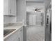 Bright kitchen with marble countertops, new appliances, and easy access to other rooms at 5611 Burlington N Ave, St Petersburg, FL 33710