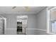 Well-lit kitchen featuring stainless steel appliances, white cabinets, and tiled backsplash at 5611 Burlington N Ave, St Petersburg, FL 33710