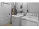 Convenient laundry room with modern washer and dryer units, water heater and storage space at 5611 Burlington N Ave, St Petersburg, FL 33710