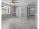 Open living space featuring sleek tile flooring and lots of natural light at 5611 Burlington N Ave, St Petersburg, FL 33710