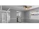 Bright living room showcasing seamless transition to the kitchen, enhanced by stylish finishes at 5611 Burlington N Ave, St Petersburg, FL 33710