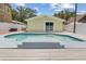 Backyard showcasing a refreshing swimming pool with a charming pool house at 5611 Burlington N Ave, St Petersburg, FL 33710