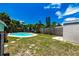 Expansive backyard with a refreshing pool, creating a serene and enjoyable outdoor space at 6411 S Clark Ave, Tampa, FL 33616