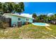 Spacious backyard with a refreshing pool, ideal for enjoying sunny days and outdoor activities at 6411 S Clark Ave, Tampa, FL 33616