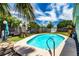 A stunning in-ground pool in a spacious backyard setting is great for recreation and relaxation at 6411 S Clark Ave, Tampa, FL 33616