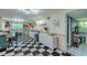 Bright dining area featuring checkered floors, modern cabinets and decorative accents at 6411 S Clark Ave, Tampa, FL 33616