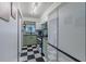 Bright kitchen with sleek appliances, modern cabinetry, and a black and white checkered floor at 6411 S Clark Ave, Tampa, FL 33616