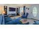 Comfortable living room featuring stylish decor and ample seating, perfect for relaxing and entertaining guests at 6411 S Clark Ave, Tampa, FL 33616
