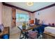 Bright work space features a modern desk, natural light, a decorative flower accent wall, and modern floors at 6411 S Clark Ave, Tampa, FL 33616
