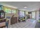 Bright work space features a patterned floor, desk space, and windows that let in a lot of natural light at 6411 S Clark Ave, Tampa, FL 33616