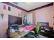 Bright work space features a modern desk, natural light, and a view to another room at 6411 S Clark Ave, Tampa, FL 33616