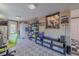 Bright open office space features views into the kitchen area, modern floors, and easy access to the outside at 6411 S Clark Ave, Tampa, FL 33616