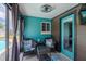 Cozy patio with comfortable seating, offering a relaxing retreat for outdoor gatherings and enjoyment at 6411 S Clark Ave, Tampa, FL 33616