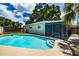 Relax and unwind in the stunning backyard pool, perfect for cooling off on hot summer days at 6411 S Clark Ave, Tampa, FL 33616