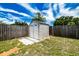 Backyard featuring a storage shed, providing practical solutions for your organizational needs at 6411 S Clark Ave, Tampa, FL 33616