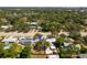 Desirable property location amid lush trees, near a scenic lake, and adjacent to a bustling main road at 6453 5Th N Ave, St Petersburg, FL 33710