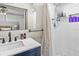 Modern bathroom with tiled shower, sleek fixtures, and ample natural light at 6453 5Th N Ave, St Petersburg, FL 33710