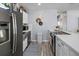 Modern kitchen has stainless steel appliances, white cabinets, and white backsplash at 6453 5Th N Ave, St Petersburg, FL 33710