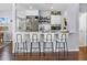 Eat-in kitchen features a breakfast bar with seating and modern appliances at 6453 5Th N Ave, St Petersburg, FL 33710