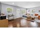 Cozy living room features hardwood floors, neutral paint, and comfortable seating at 6453 5Th N Ave, St Petersburg, FL 33710