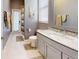 Bright bathroom featuring gray vanity with granite countertop and walk-in shower at 7244 Wild Oak Ln, Land O Lakes, FL 34637