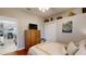 Bedroom with hardwood floors and views into dining area at 7244 Wild Oak Ln, Land O Lakes, FL 34637