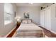 Comfortable bedroom with wood floors, natural light from the window, and spacious closet at 7244 Wild Oak Ln, Land O Lakes, FL 34637