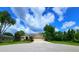 Beautiful home with a well-manicured lawn and a three-car garage located on a cul-de-sac at 7244 Wild Oak Ln, Land O Lakes, FL 34637