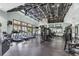 Spacious gym with high ceilings, abundant natural light, and a variety of exercise equipment at 7244 Wild Oak Ln, Land O Lakes, FL 34637