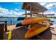Kayaks racked up and ready to launch from the community dock at Wilderness Lake Preserve at 7244 Wild Oak Ln, Land O Lakes, FL 34637