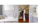 The main bedroom features hardwood floors, a ceiling fan, a dresser, and access to the bathroom at 7244 Wild Oak Ln, Land O Lakes, FL 34637