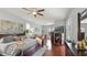 Large main bedroom with hardwood floors, natural light, and stylish furnishings at 7244 Wild Oak Ln, Land O Lakes, FL 34637