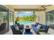 Relaxing outdoor living space with comfortable seating overlooking the screened-in pool and backyard at 7244 Wild Oak Ln, Land O Lakes, FL 34637