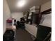 Storage room with mechanical equipment and storage containers at 7244 Wild Oak Ln, Land O Lakes, FL 34637