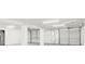 Spacious basement offering multiple garage doors, providing convenient access and storage options at 7630 Sailwinds Pass, Port Richey, FL 34668