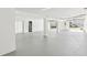 Expansive basement featuring multiple garage doors and versatile space for various needs at 7630 Sailwinds Pass, Port Richey, FL 34668