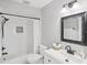 Updated bathroom with subway tile shower, vanity, and modern fixtures at 7630 Sailwinds Pass, Port Richey, FL 34668