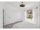 Light bedroom features a large window and two closets at 7630 Sailwinds Pass, Port Richey, FL 34668