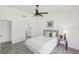 Bright bedroom features a neutral palette and en-suite bathroom at 7630 Sailwinds Pass, Port Richey, FL 34668