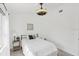 Well-lit bedroom boasts a modern ceiling fan and stylish decor at 7630 Sailwinds Pass, Port Richey, FL 34668
