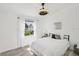 Bright bedroom with natural light, large window, and minimalist design at 7630 Sailwinds Pass, Port Richey, FL 34668