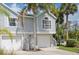 Charming two-story townhouse with a one-car garage and attractive landscaping at 7630 Sailwinds Pass, Port Richey, FL 34668